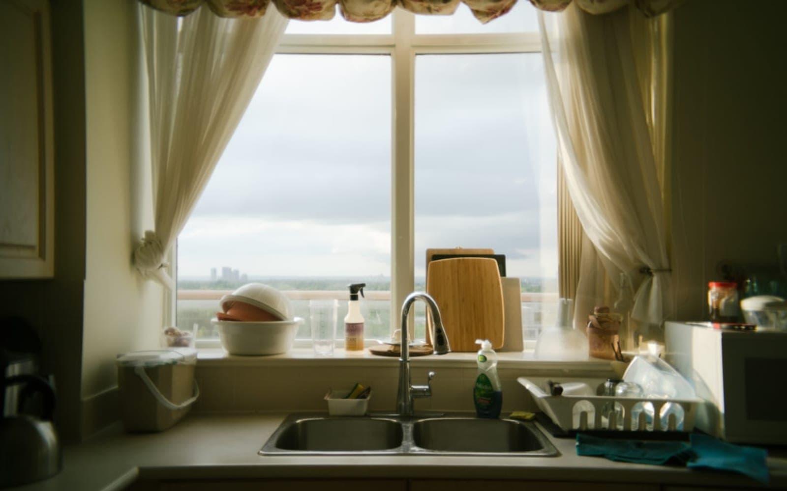 A kitchen with a sink and a window