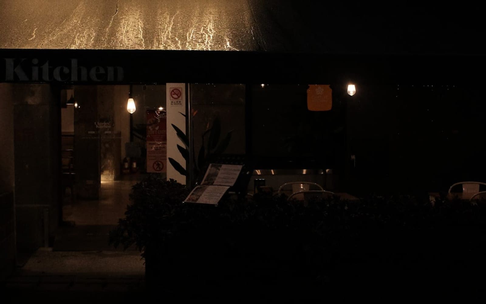 Restaurant entrance at night with warm lighting