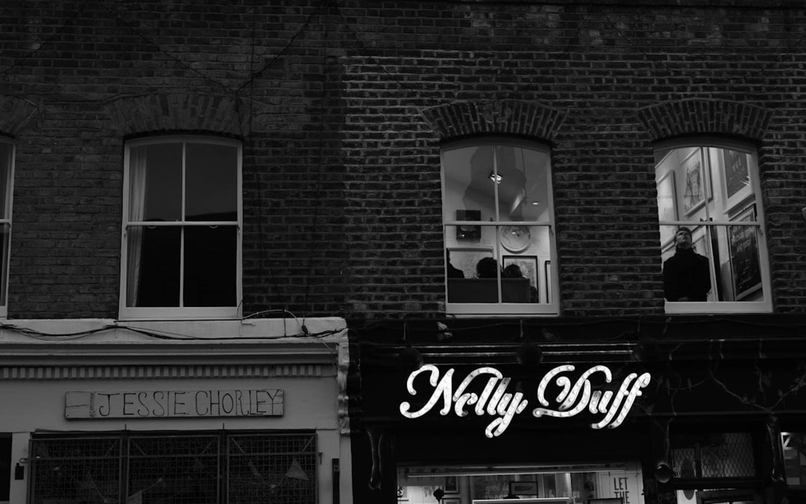 grayscale photo of UNKs coffee shop