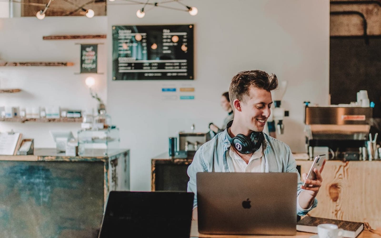 man using smartphone smiling