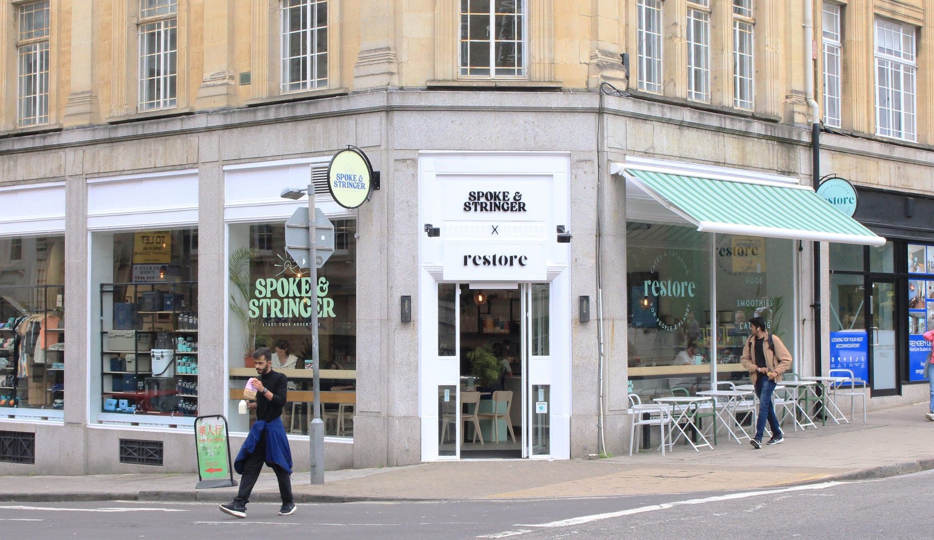 Spoke and Stringer storefront on a Bristol corner, next door to the Restore café
