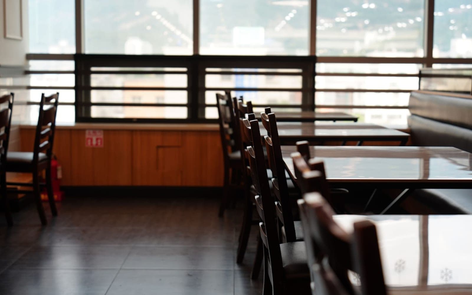 Empty restaurant tables and chairs